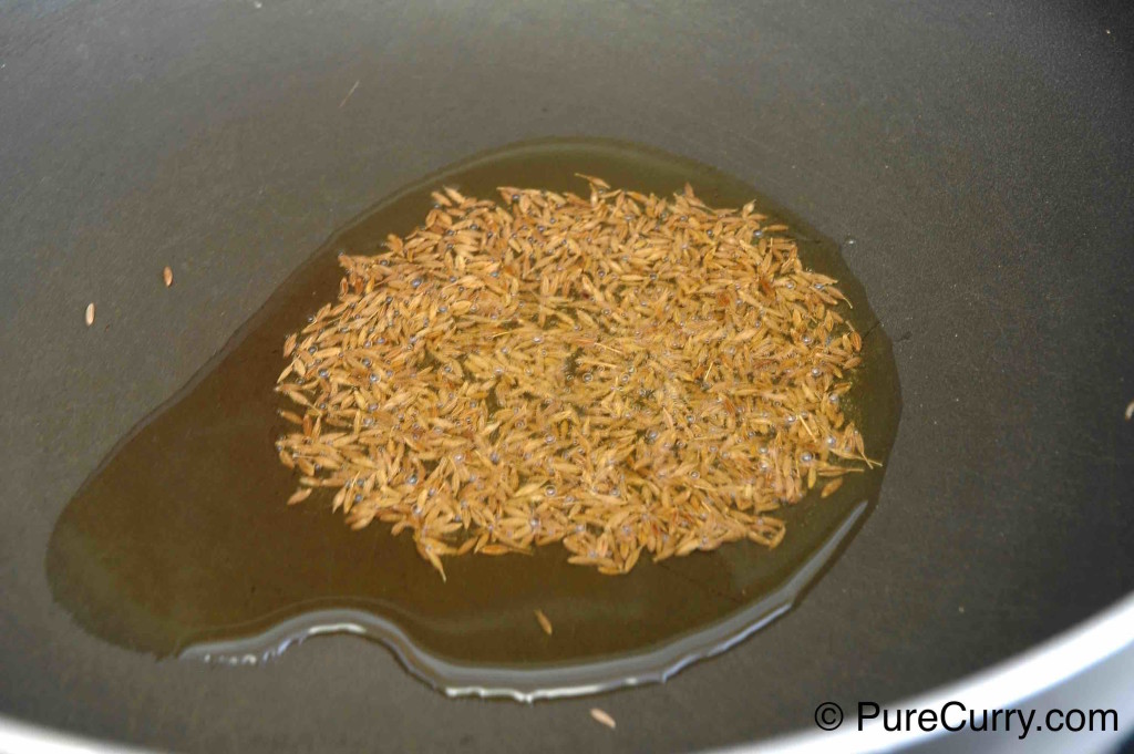 Cumin seeds being fried