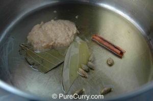 Oil, Ginger-garlic paste, Bay leaves, Cardamoms and Cinnamon